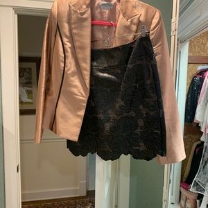 Peach and black leather skirt and silk jacket